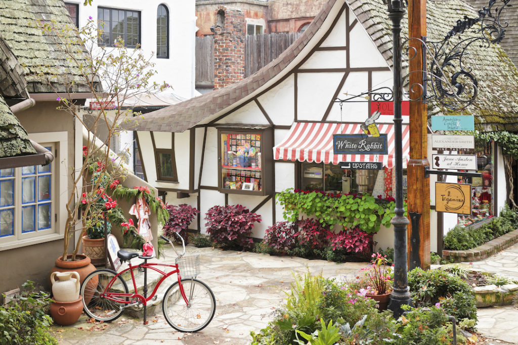 Carmel by the Sea, USA - January 2, 2016: A streetscape in Carmel-by-the-Sea featuring a retail shop housed in a typical fairytale cottage - style architecture. Carmel located on the Monterey Peninsula was founded in 1902 and is known for its natural scenery and artistic history.